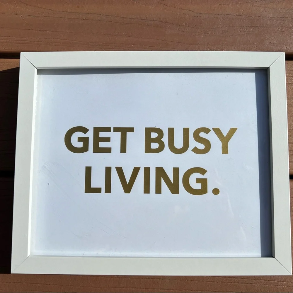 9x11” framed ‘get busy living’ saying in gold font.